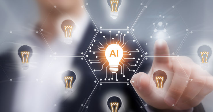 アイデアを示す電球のシルエットに『AI』の文字が浮かび、周囲の電球に光が伝わる途中。ビジネスマンがまだ何もないスペースを指差し、新しい活用を示唆している。